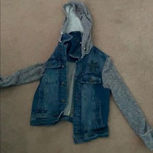 Jean jacket with grey sweater sleeves and hood